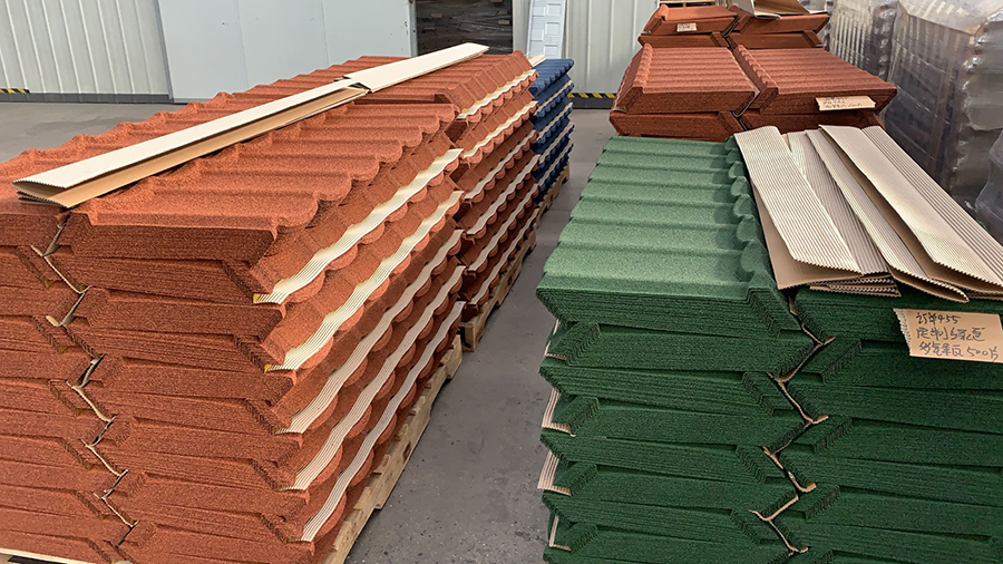 A tile roofing system consists of overlapping roof tiles securely attached to a solid substrate or roof deck on a sloped roof.